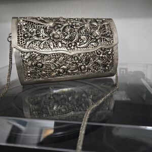 Metal clutch with shoulder strap